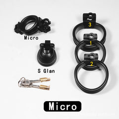 Micro black chastity cage set shown with three rings, lock body and keys