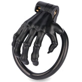 Black skeleton-hand resin chastity cage with four rings and keys