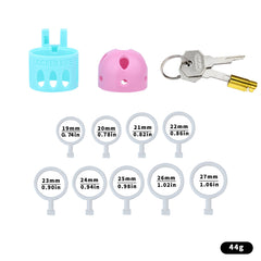 Pink and blue ringless bullet cage kit without belt, with nine inner rings and keys