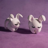 Small and large white Rogue Rabbit nylon chastity cages