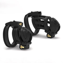 Two black double-headed chastity cage profiles in three-quarter view
