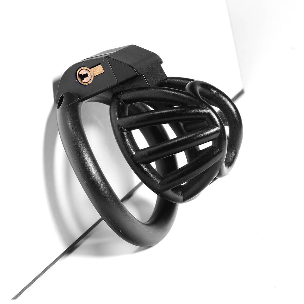 Black small chastity cage in a close three-quarter view
