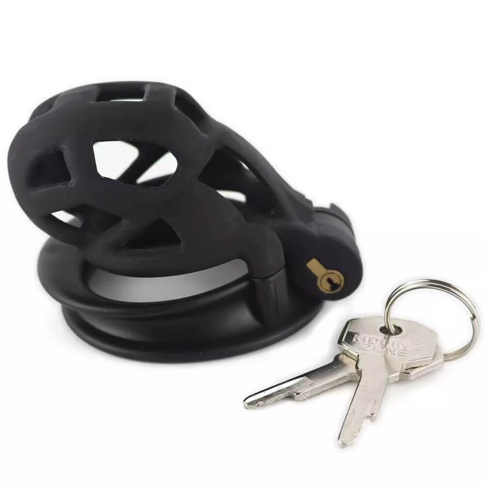 Black Cobra 6.0 cage lying on its side beside keys
