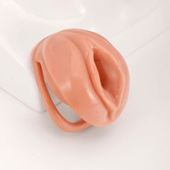 Faux labia chastity cage in pink and skin-tone colors