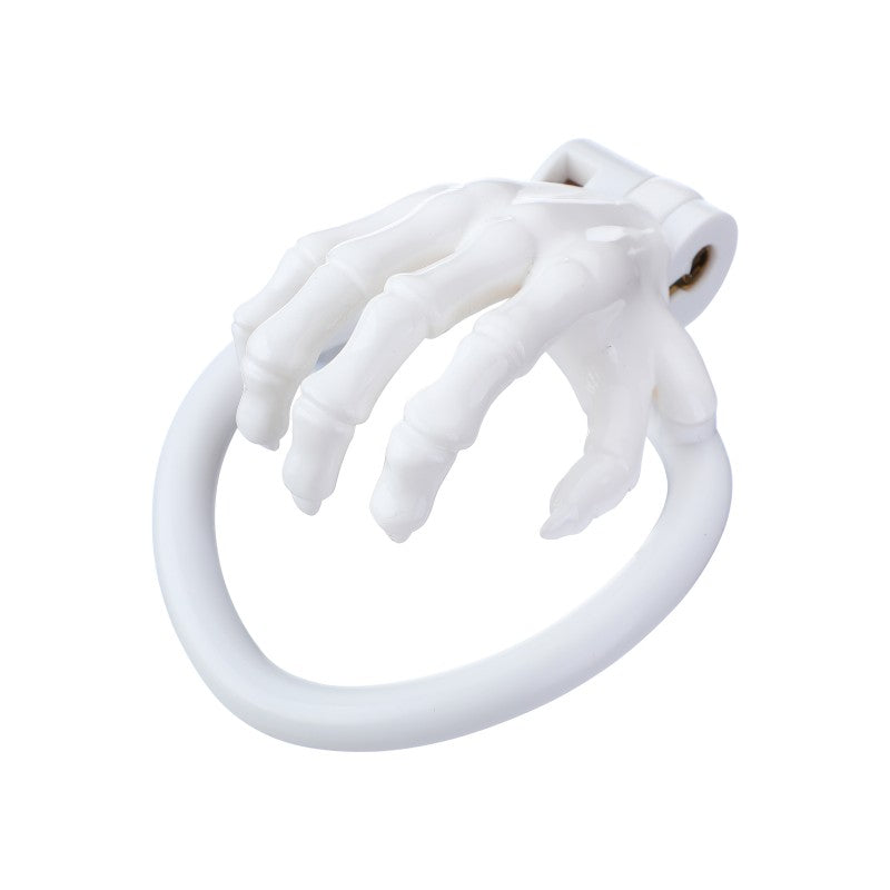 Claw-shaped finger details on skeleton-hand chastity cage