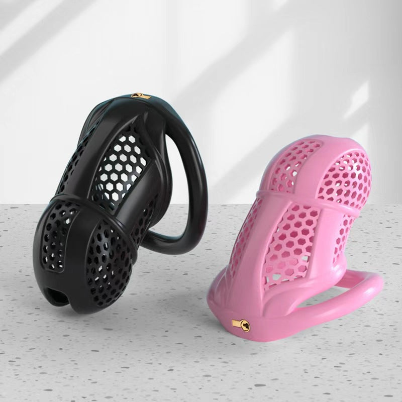 Black and pink honeycomb cages on a light display surface
