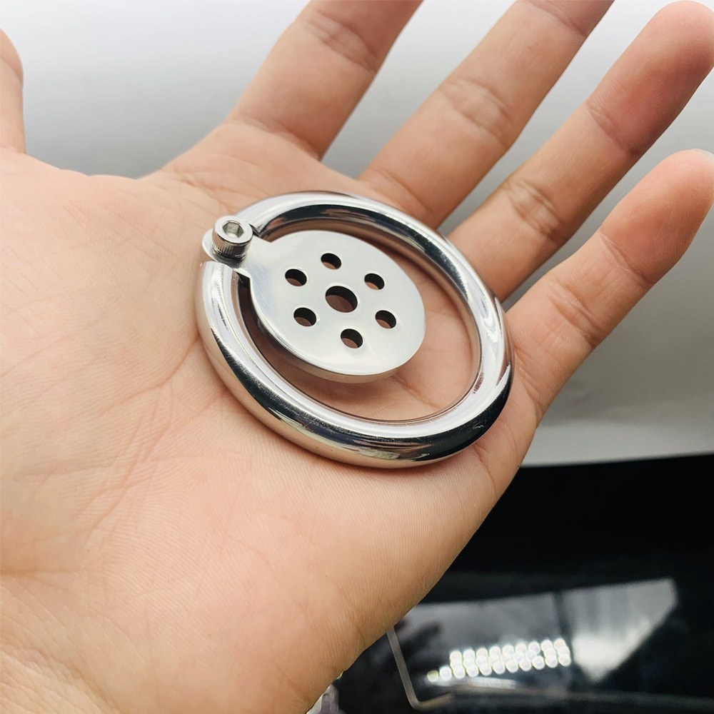 JTS S235 flat stainless steel cage resting in a hand
