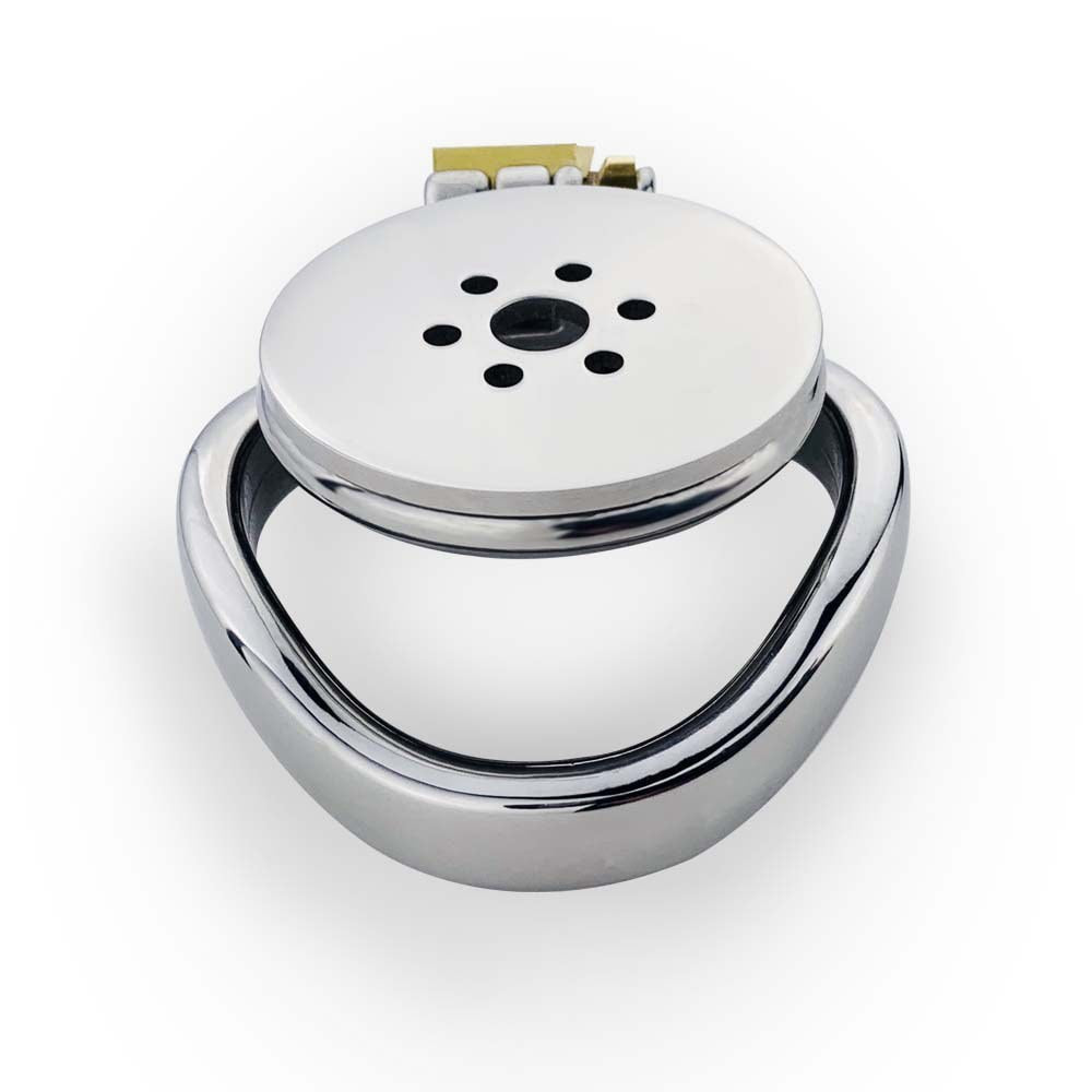 JTS S239 flat chastity cage with a curved base ring and perforated front plate, viewed at an angle