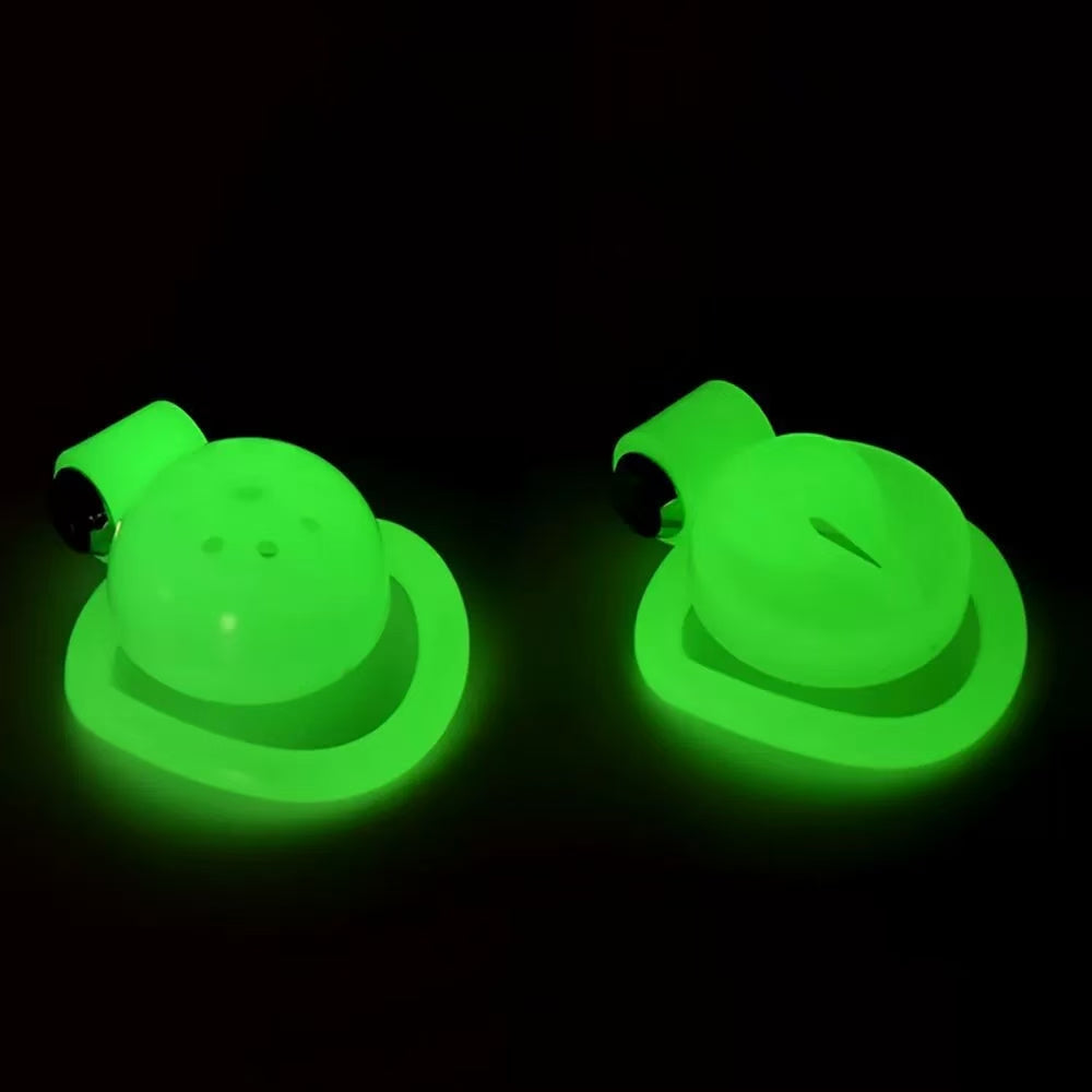 Domed and Pussy B ABS cage fronts glowing green side by side
