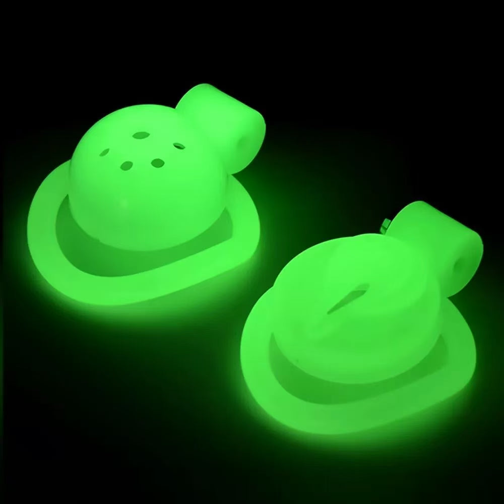 Flat-disc and Pussy A ABS cage fronts glowing green side by side
