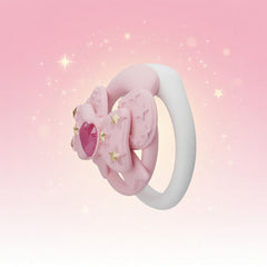 Side view of pink bow silicone chastity cage and white base ring