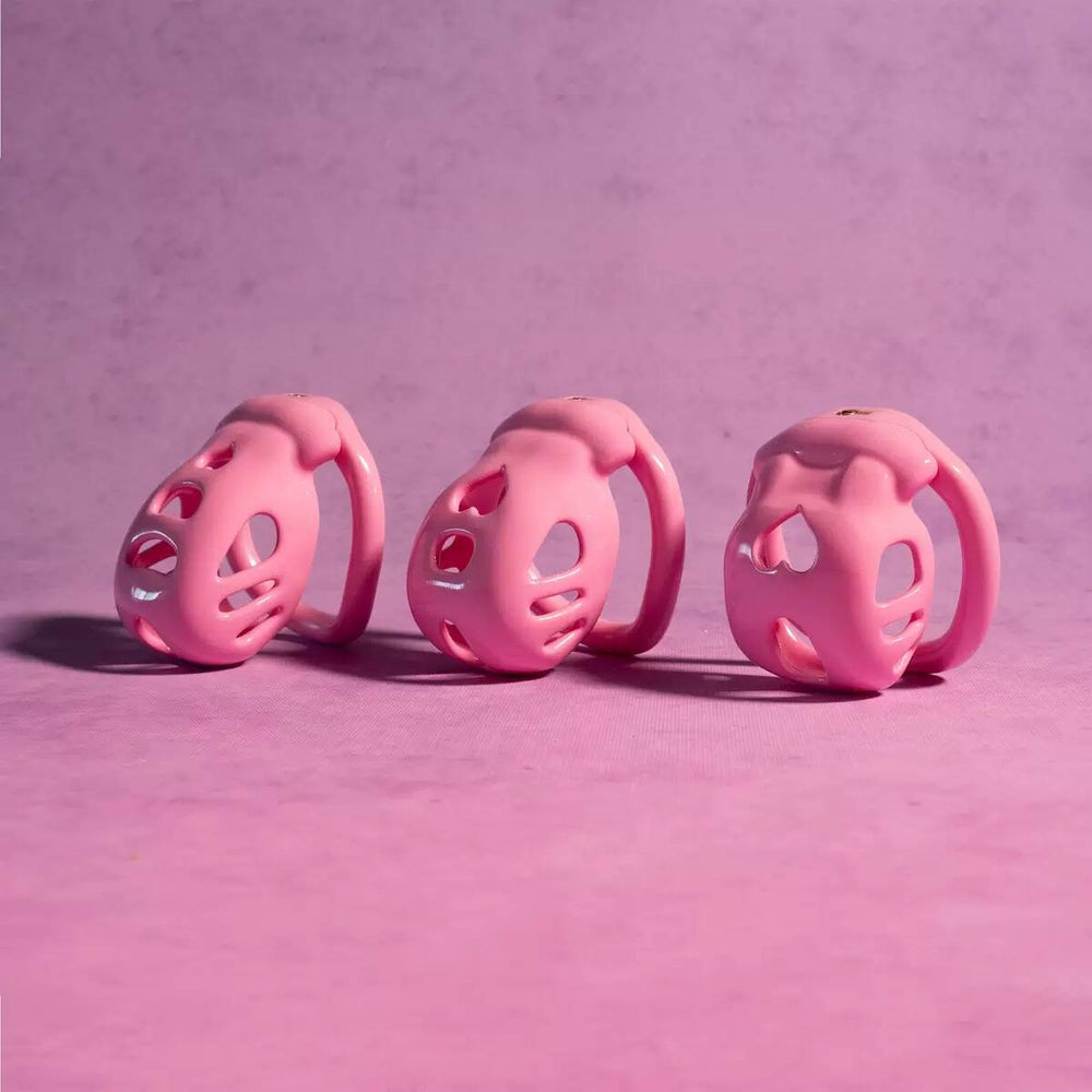 Pink heart-detail chastity cages in small medium and large sizes