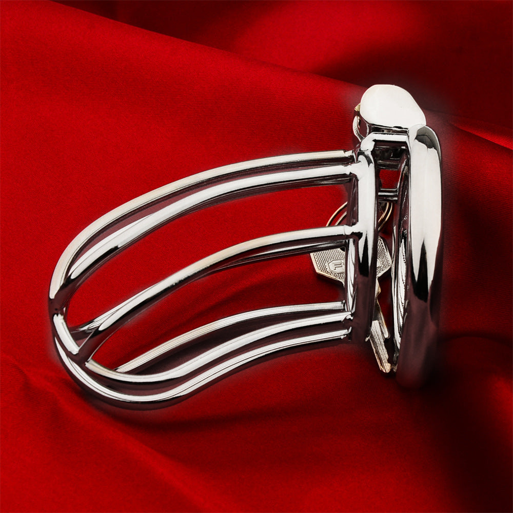 Side view of The Siebe Bonnet integrated-lock cage on red fabric
